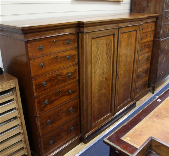 A late Regency banded mahogany breakfront linen press, 	 W.222cm